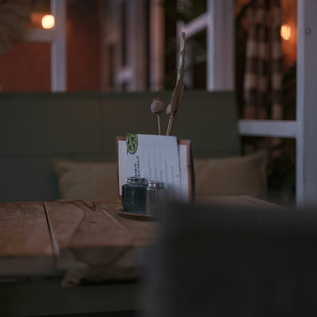 Photographer setting up camera on tripod in restaurant