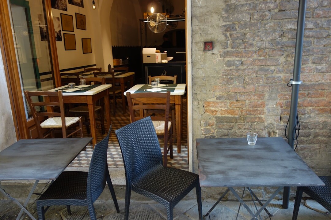 Rustic stone konoba restaurant interior with wooden tables