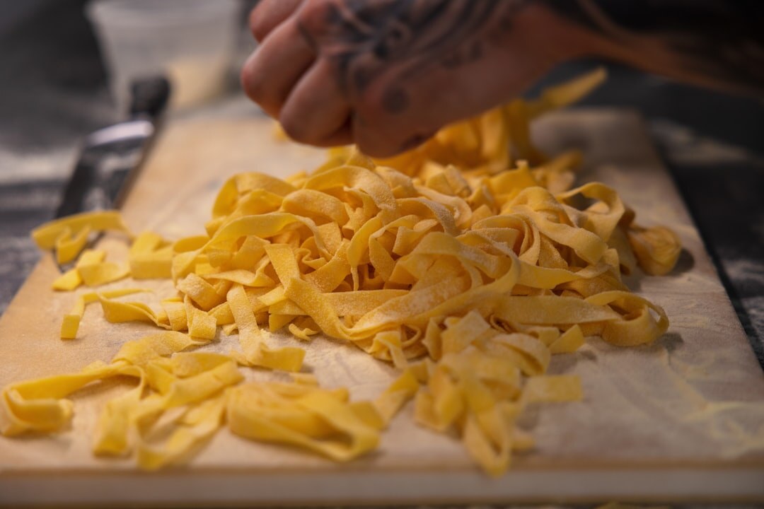 Close-up of hands making fresh pasta in Split kitchen