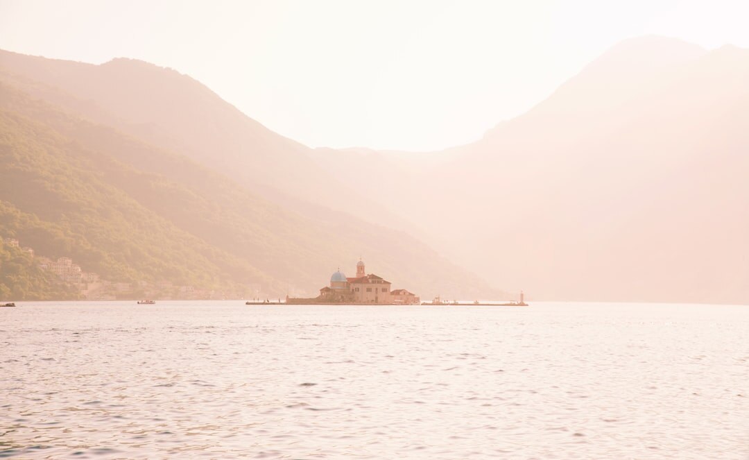 Calm sea and cliffs of small Adriatic island at dawn