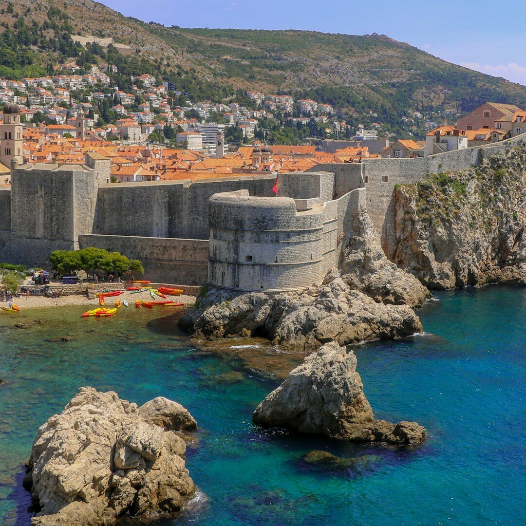 Dubrovnik city walls overlooking terracotta rooftops and sea