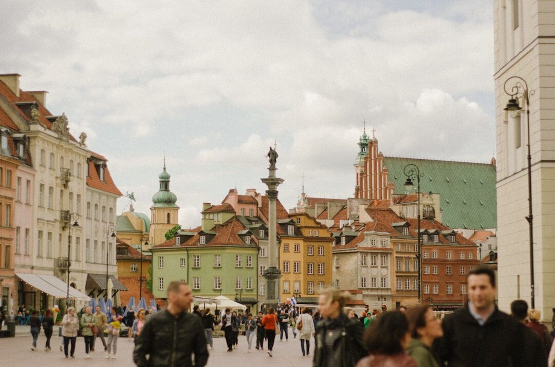 Crowd enjoying outdoor summer festival in old town square