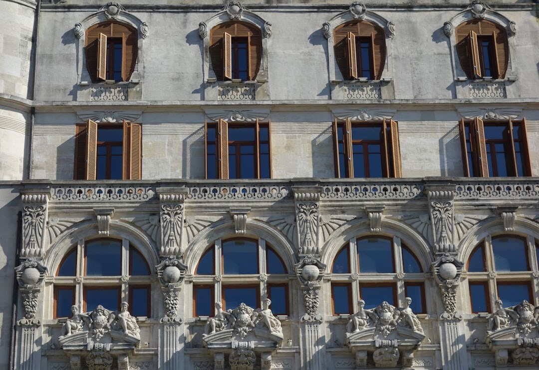 Detail of Romanesque stone facade with arched windows