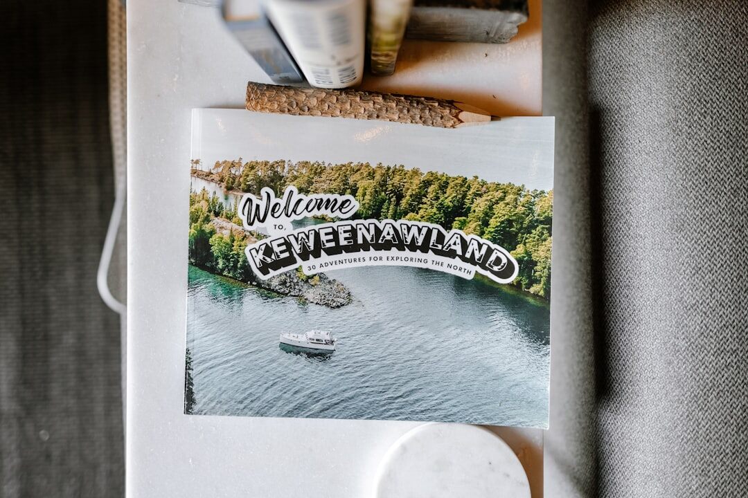 Map and camera on wooden table with travel notes